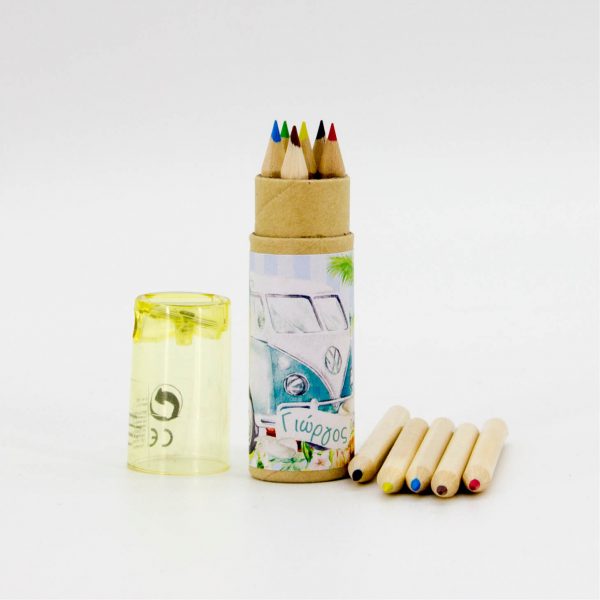 Μπομπονιέρα για βάπτιση με ξυλομπιγιλες σε κυλινδρική κασετίνα, με τυπωμένο το θέμα της βάπτισης