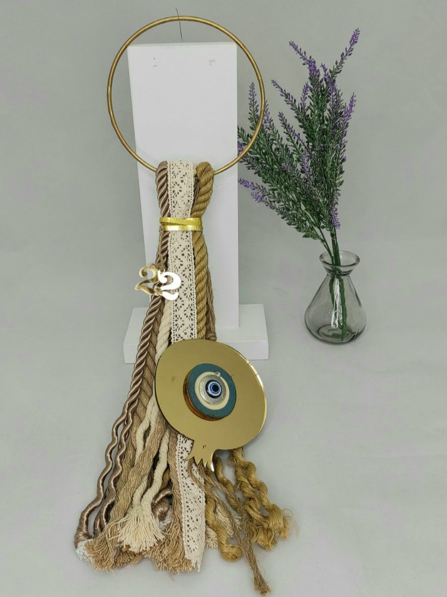 20211122_192226 Γούρι 2022 boho style με μάτι, διακοσμητικά στοιχεία επιχρυσωμένα με 24 καράτια , με σατέν κορδόνι και μεταξωτή φούντα. Μήκος 56εκ. Ένα πολυτελές γούρι, ιδανικό δώρο για το σπίτι ή το γραφείο