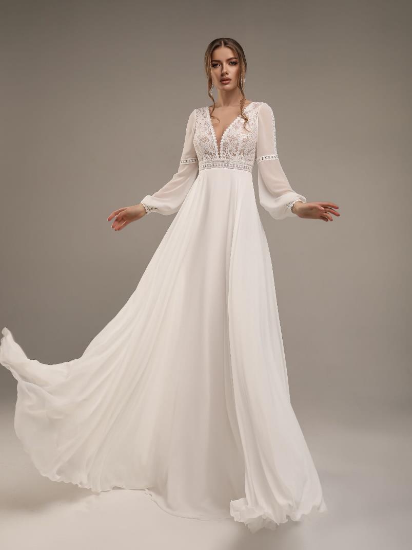 Αέρινο νυφικό φόρεμα με μπούστο δαντέλα και μανίκι